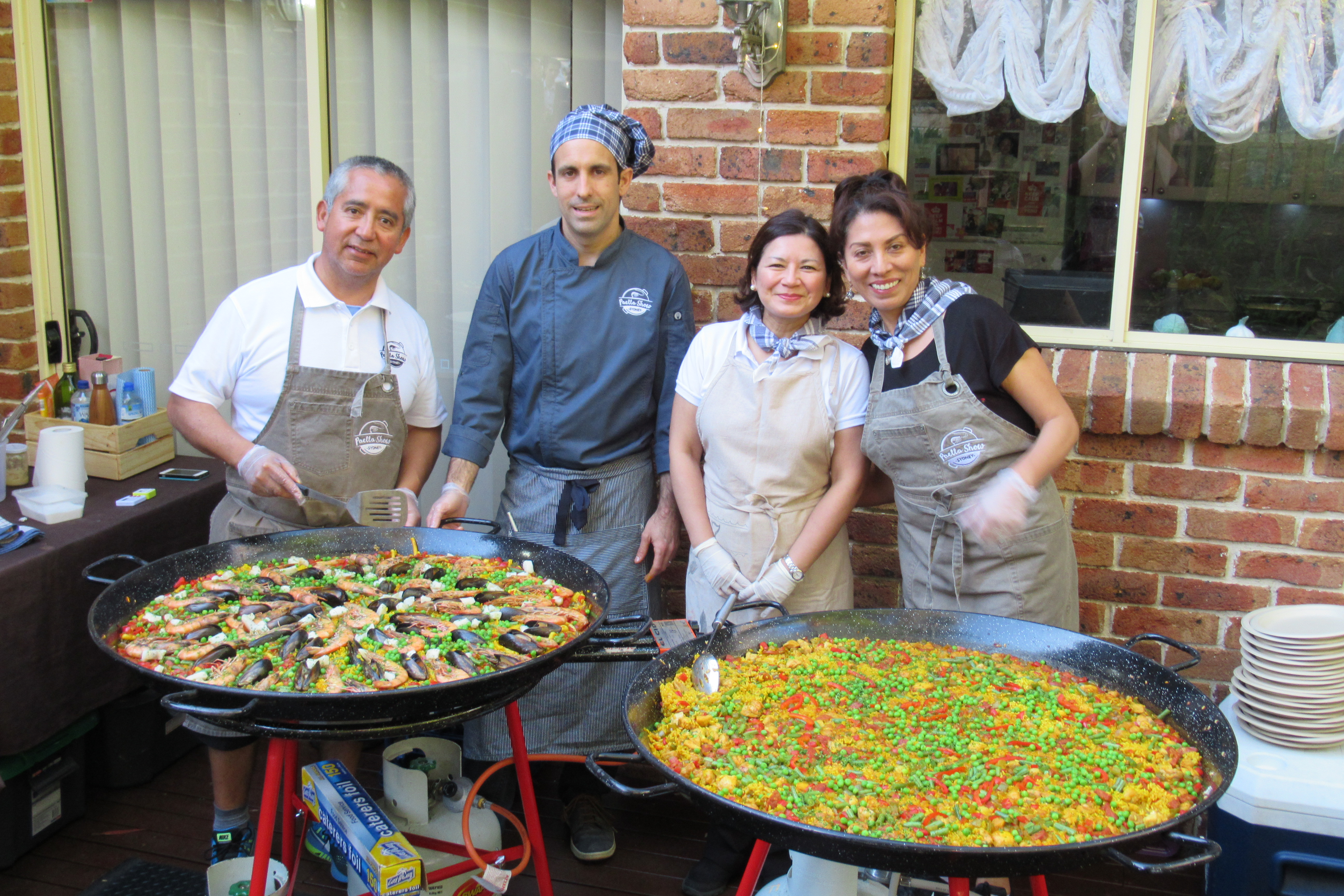 Paella catering team, cooking for a engagement party